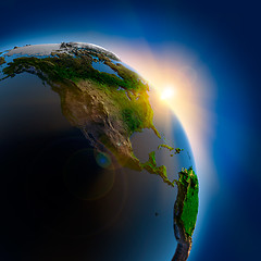 Image showing Sunrise over the Earth in outer space