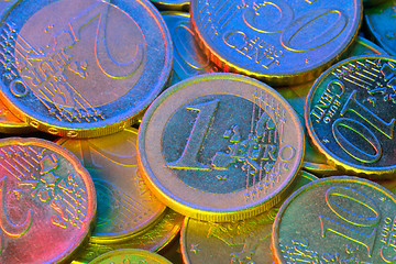 Image showing Euro coins, illuminated by colored light