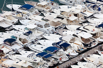 Image showing Large parking boats at sea in a small seaside town