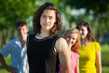 Image showing Korean youth against the background of his friends