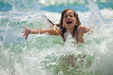 Image showing Little girl at sea in sunny day