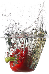 Image showing Red pepper falling in a water