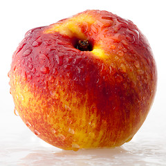 Image showing Peach in droplets of water