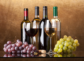 Image showing Bottles, glasses and grapes