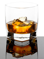 Image showing Glass of whiskey with ice cubes