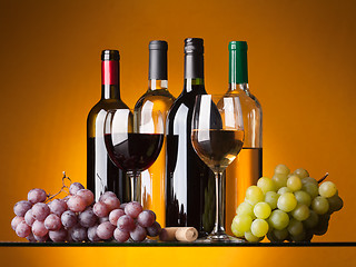 Image showing Bottles, glasses and grapes