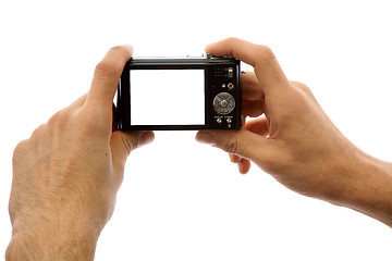 Image showing Photo camera in hands isolated on white background