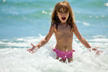 Image showing Little girl at sea in sunny day