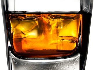Image showing Glass of whiskey with ice cubes
