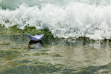 Image showing Paper boat now die in a huge wave