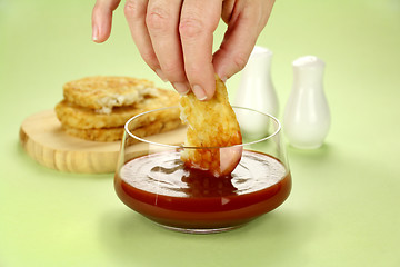 Image showing Dipping Hash Browns