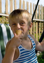 Image showing The boy with ice-cream