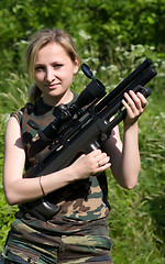 Image showing The girl with an air rifle.