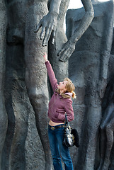 Image showing The girl near a sculpture