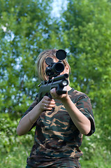 Image showing The girl with an airgun.