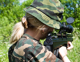 Image showing The girl with a rifle.