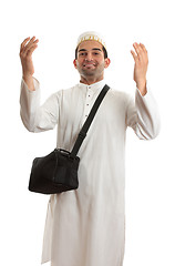 Image showing Ethnic man with arms raised in praise