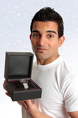 Image showing Man holding box product