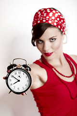 Image showing Girl holding a clock