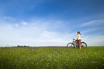 Image showing Girl with a bicycle