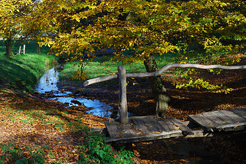Image showing Wooden bridge and stream