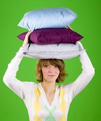 Image showing woman with pillows stack