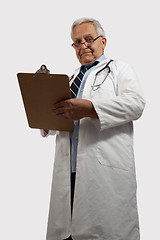 Image showing Stern looking older doctor
