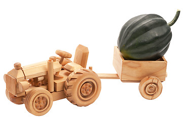 Image showing Toy tractor with green pumpkin.