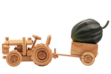 Image showing Toy tractor with green pumpkin.