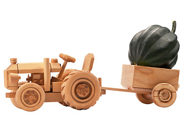 Image showing Toy tractor with green pumpkin.