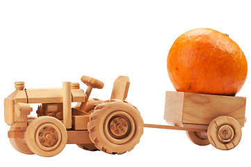 Image showing Toy tractor with orange pumpkin.