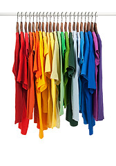 Image showing Colors of rainbow, shirts on wooden hangers