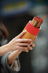 Image showing soothsaying, shake bamboo cylinder for fortune tell
