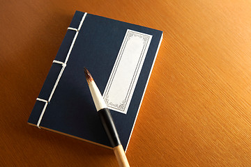 Image showing chinese book and writing brush