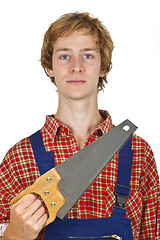 Image showing Carpenter with handsaw