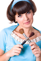 Image showing woman in blue dress with two make-up brushes 