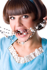 Image showing woman in blue dress with pearl beads