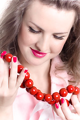 Image showing woman with red beads