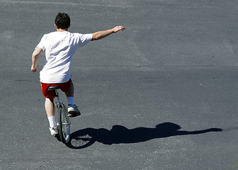 Image showing Boy on a unicycle
