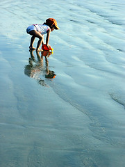 Image showing Kid playing on the beach