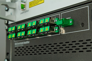 Image showing SC fiber optic adapters covered against high optical power