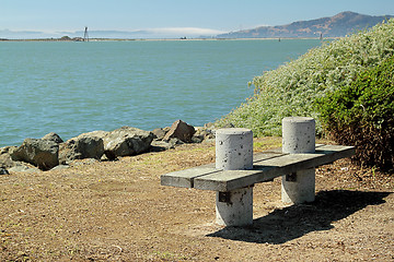 Image showing A bench on the seashore