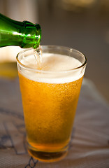 Image showing Pouring beer into glass