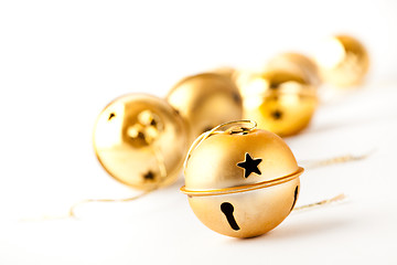 Image showing Golden Christmas baubles on white