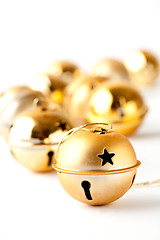 Image showing Golden Christmas baubles on white