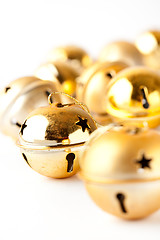 Image showing Golden Christmas baubles on white