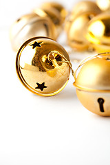 Image showing Golden Christmas baubles on white