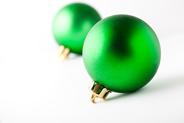 Image showing Green Christmas baubles on white