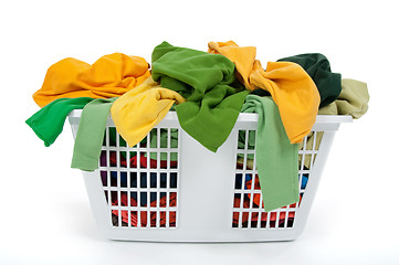 Image showing Colorful clothes in laundry basket. Green, yellow.