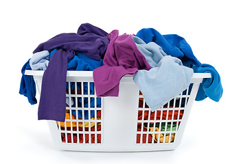Image showing Colorful clothes in laundry basket. Blue, indigo, purple.